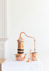 Distillation of lavender essential oil. Copper alambic in a Scandinavian interior. - 777766645