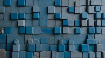 Various shapes in different shades of blue on a wall.

