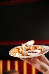 holding plate with cheese set with  jam, fruit and nuts