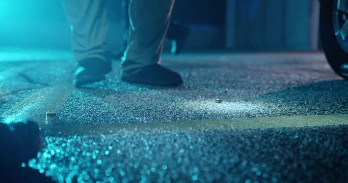 Police Detectives Places Yellow Evidence Markers next to Bullets on Concrete, Night, Crime Scene, Slow Motion