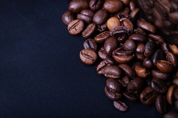 Coffee Beans in studio on a black table background with contrast and deep colors