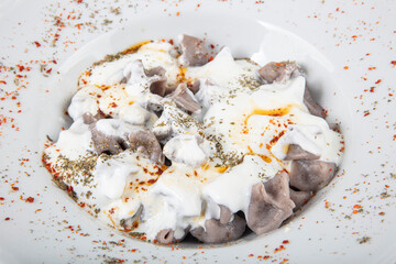 Manti from buckwheat flour. Manti Turkish Ravioli Kayseri with yogurt and chili sauce.