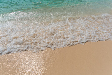 Fototapeta na wymiar Sand beach and ocean wave