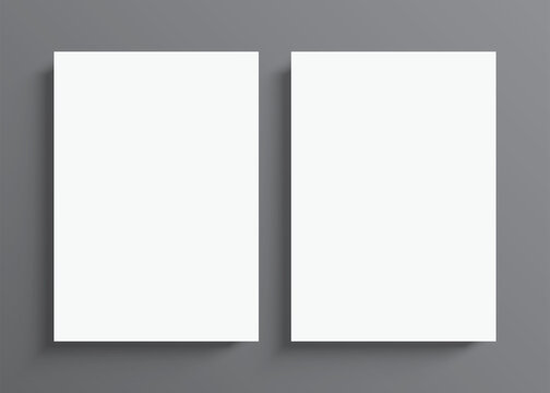 2 blank white paper posters hanging on a grey wall background. Poster gallery vector mockup for vertical art, image, or text placement.