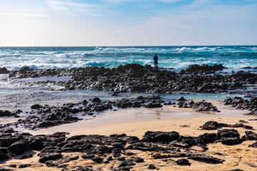West coast of Fuerteventura island. Winter sea and sun vacation in El Cotillo touristic village, Canary islands, Spain. White sandy beach La Concha..