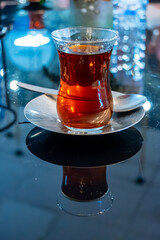 Turkish sweet tea served in traditional glass in restaurant in Istanbul, Turkey