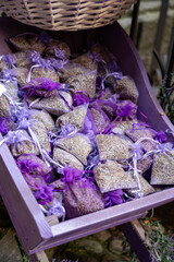 Small violet bags with aromatic seeds of lavender plant on market in Provence