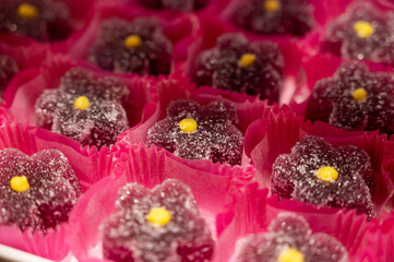 French or italian sweets, fruit jelly bonbons on display in confectionery shop in Milan, Italy...