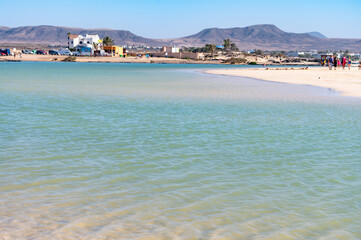 West coast of Fuerteventura island. Winter sea and sun vacation in El Cotillo touristic village, Canary islands, Spain. White sandy beach La Concha..
