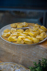 Italian food, fresh homemade stuffed pasta tortelli or ravioli dumplings ready to cook, Milan, Lombardy, Italy