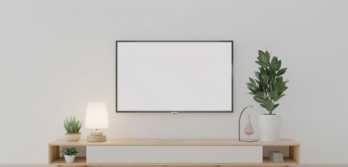 A minimalist TV cabinet featuring a TV mockup with a white screen, accompanied by a small potted plant and a sleek lamp, against a white wall background - obrazy, fototapety, plakaty
