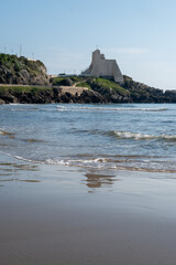View on sandy beach and sea water in medieval small touristic coastal town Sperlonga and sea shore, Latina, Italy