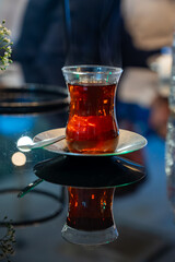 Turkish sweet tea served in traditional glass in restaurant in Istanbul, Turkey