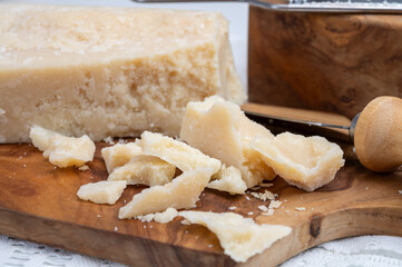Traditional italian food - 22 months aged in caves Italian parmesan hard cheese from Parmigiano-Reggiano, Italy