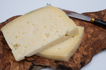 Fresh Asiago cow's milk cheese, from Asiago in Italy, used in panini or sandwiches or melted on variety of dishes, classified as a Swiss-type Alpine cheese