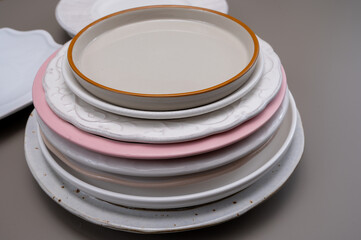 Stack of different ceramic or porcelain trendy plates