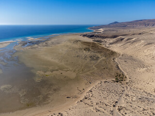 Aerial view on sandy dunes and turquoise water of Sotavento beach, Costa Calma, Fuerteventura, Canary islands, Spain in winter
