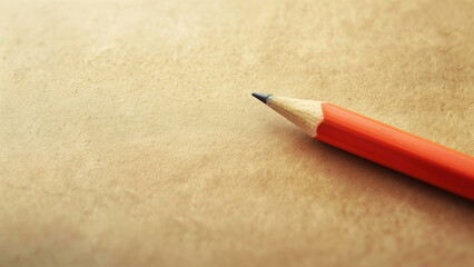 Pencil on old paper background with copy space for your text.