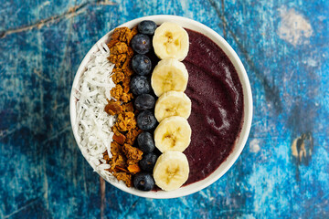 Blueberry smoothie bowl with coconut and granola