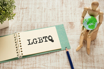 There is notebook with the word LGBTQ. It is an abbreviation for Lesbian, Gay, Bisexual,...