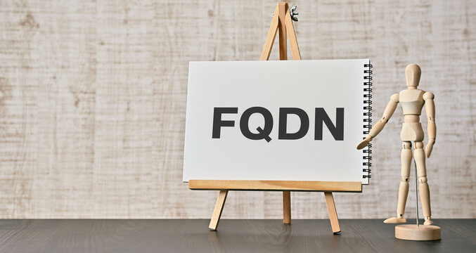 There is notebook with the word FQDN. It is an abbreviation for Fully Qualified Domain Name as eye-catching image.