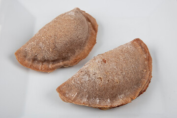 Leek pastry made from buckwheat flour. Homemade savory hand pies. Pastry with special vegetable...