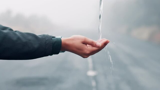 Hands, water and splash outdoor for sustainability, person for health and hygiene with rewind, fresh and clean. Liquid, mineral and wellness with drops, backtrack for cleanliness and natural