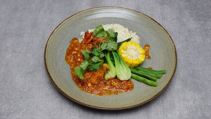 Seafood, rice, fresh vegetables, shrimp sauce, boiled corn, Indonesian food