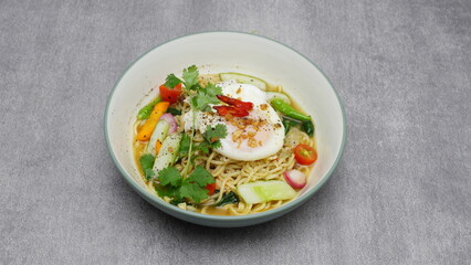 Typical Indonesian food, special Indomie Matasapi eggs, vegetables and sliced ​​chilies