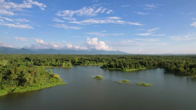 Beautiful landscape view of green forest tree and liab lake view of reservoir in Thailand.