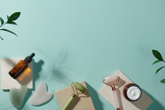 Massage tools. Guasha massager, jade facial rollers and serum
