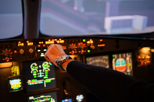 Hand Using An Aircraft Cabin, Flight Academy Simulator.