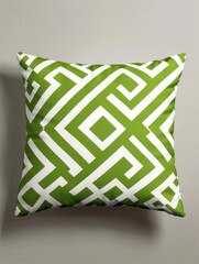 Green and white geometric patterned pillow - A stylish green and white geometric pattern featured on a comfortable decorative pillow, showcasing modern home decor
