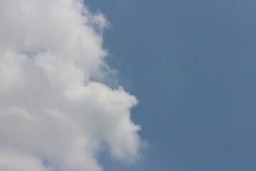 blue sky background with tiny clouds.