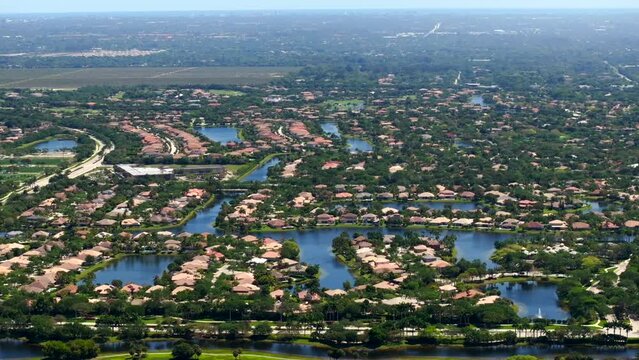 Aerial telephoto 3x zoom drone video luxury homes in Parkland Florida USA