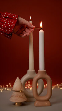 Christmas scene with candles and hand