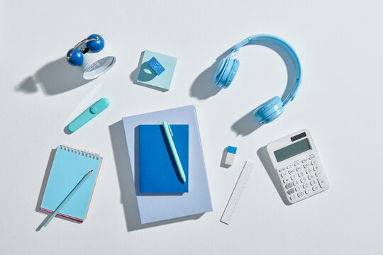 Flat lay of set of assorted modern stationery in order on desk