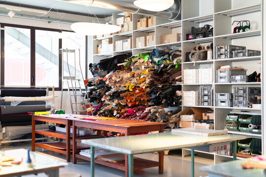 Interior of recycled leather fashion workplace with supplies