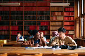 Students in library studying together