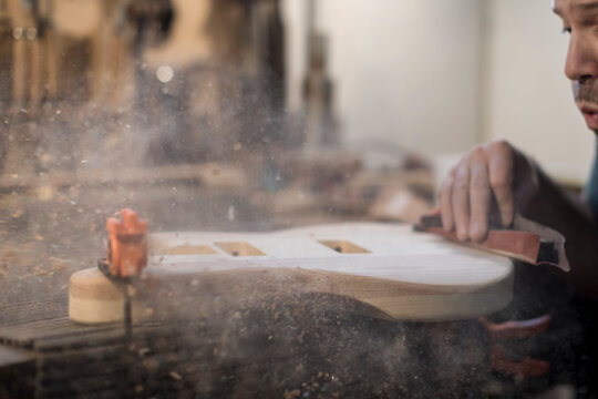 Luthier blow the wood away