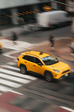 yellow blurred cab in the streets of NYC