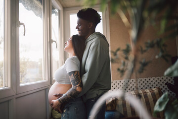 Diverse pregnant couple In Love relaxed