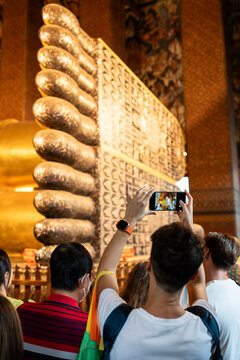 Tourist taking photographs in a temple.