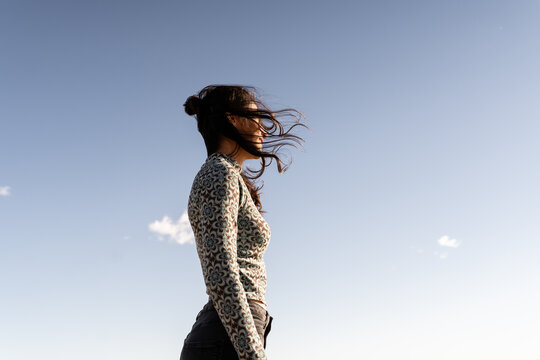 Woman at beach windy 