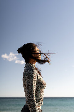 Woman at beach windy 