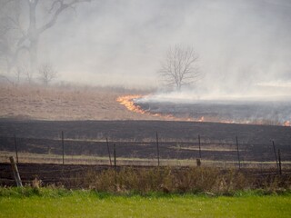Fire from controlled agricultural burning in the Kansas Flint Hills; the last stand of tallgrass...