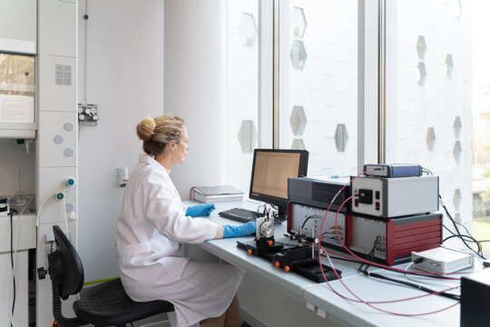 Scientist Working In Modern Laboratory