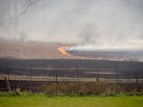 Fire from controlled agricultural burning in the Kansas Flint Hills; the last stand of tallgrass prairie in North America. 