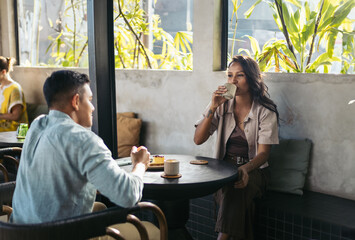 Friends having coffee in a modern coffee shop in Bali