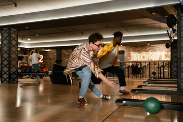 A men is playing bowling